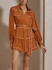 Button Front Long Sleeve Shirt Dress in rust color with buttoned, tiered, belted design, no stretch, 97% polyester, 3% spandex material.