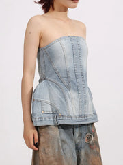 Model wearing Zip Back Denim Tube Top with modern denim finish and structured strapless design.