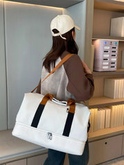 Person carrying Multifunctional Waterproof Travel Duffel Bag in a modern setting, highlighting the bag's spacious and sturdy design.