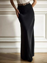 High-Waisted Maxi Skirt in black polyester blend, basic style, worn indoors, showcases elegant design.