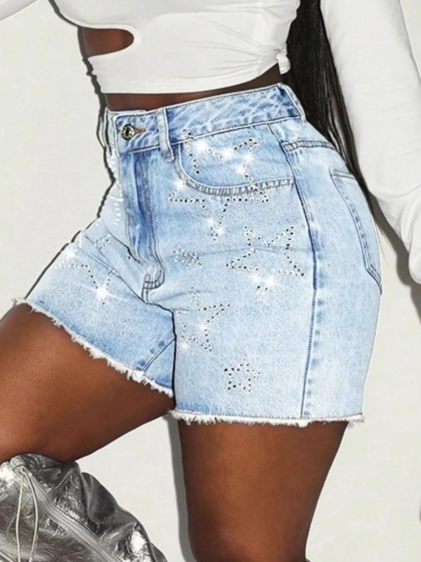 Star Raw Hem Denim Shorts with frayed edges and soft stretch for comfort, shown with star details, paired with a cropped white top.