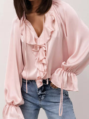 Ruffle Trim Satin Flounce Sleeve Blouse in pink with tie-neck detail and ruffled front, styled with denim for a day-to-night look.