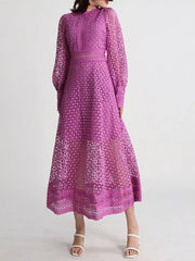 Violet lace long sleeve midi dress with geometric cutouts, elegant design, and sheer puff sleeves.
