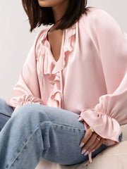 Ruffle Trim Satin Flounce Sleeve Blouse with tie-neck detail, perfect for day-to-night elegance, paired with casual jeans.