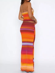 Woman wearing a colorful striped tube top and skirt set; a two-piece outfit made of 100% polyester with a slightly stretchy fit.