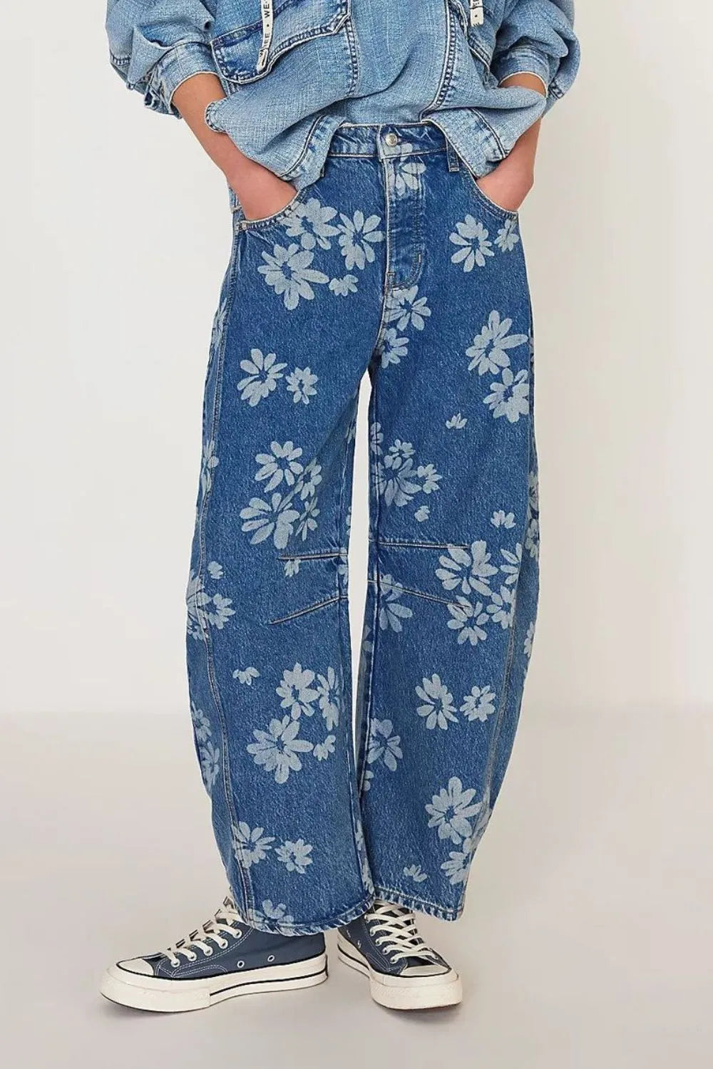 Flower Print Wide Leg Pants showcasing a floral design on denim, styled with a casual tee and sneakers.