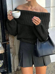 Model wearing Off-Shoulder Ribbed Long Sleeve Sweater with oversized fit, holding a coffee cup.
