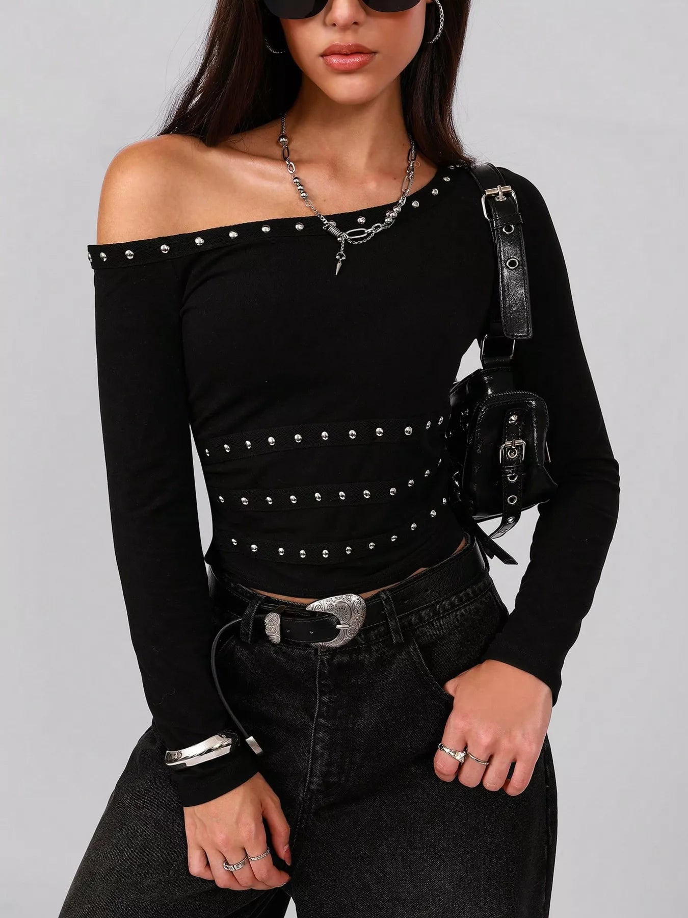 Model wearing Studded One Shoulder Long Sleeve T-Shirt, featuring studded design, slightly stretchy material, and polyester elastane blend.