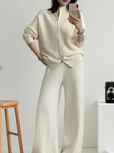 Casual Knit Cardigan and Wide-Leg Pants Set modeled by a woman in a neutral room, showcasing the two-piece outfit.