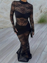 Woman wearing Lace Sheer Mock Neck Long Sleeve Maxi Dress on a patio, showcasing the elegant sheer floral design with high neckline.