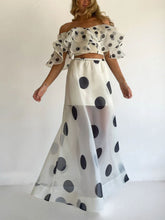 Model wearing Polka Dot Ruffle Crop Top and Maxi Skirt Set, off-shoulder, summer two-piece outfit