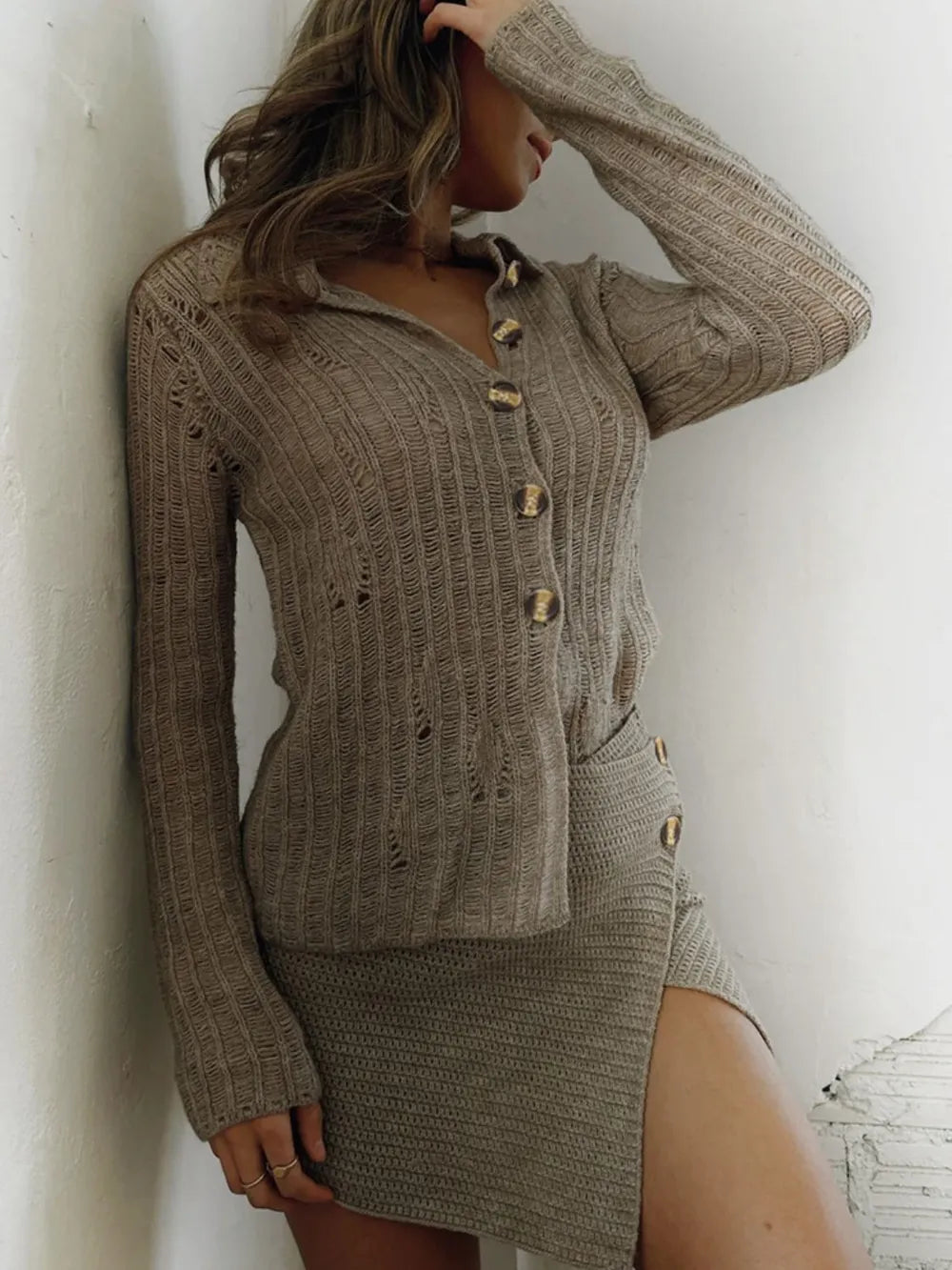 Woman wearing a Perfee button-up long sleeve cardigan with a matching skirt, showcasing a relaxed fit and soft knit texture.