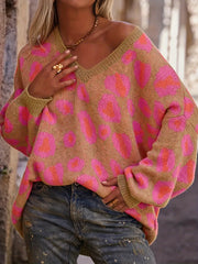 Leopard Oversized V-Neck Sweater with pink and tan pattern worn outdoors
