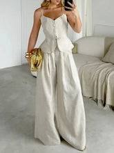 Model wearing a lightweight cotton V-neck cami and wide-leg pants two-piece set, showcasing button details and summer style.