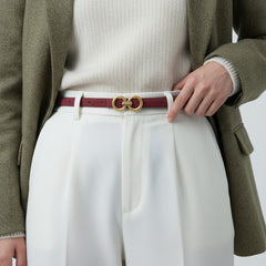Person wearing a Golden Double Circle Buckle Belt made of cowhide leather, accentuating white pants and a blazer, adding a stylish touch.