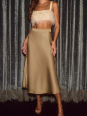 Model wearing Satin Midi Skirt with high-waist and silky finish, perfect for chic and stylish day-to-night looks.