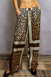 POL Leopard Printed Woven Wide Leg Drawstring Pants showcasing bold leopard design and flowy fit