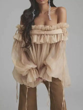 Savvy Romance Ruffle Off-Shoulder Blouse with layered ruffle detailing and flowing sleeves, showcasing feminine and airy silhouette.