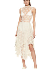 Model wearing ivory asymmetrical lace midi skirt with sheer floral design and partial lining.