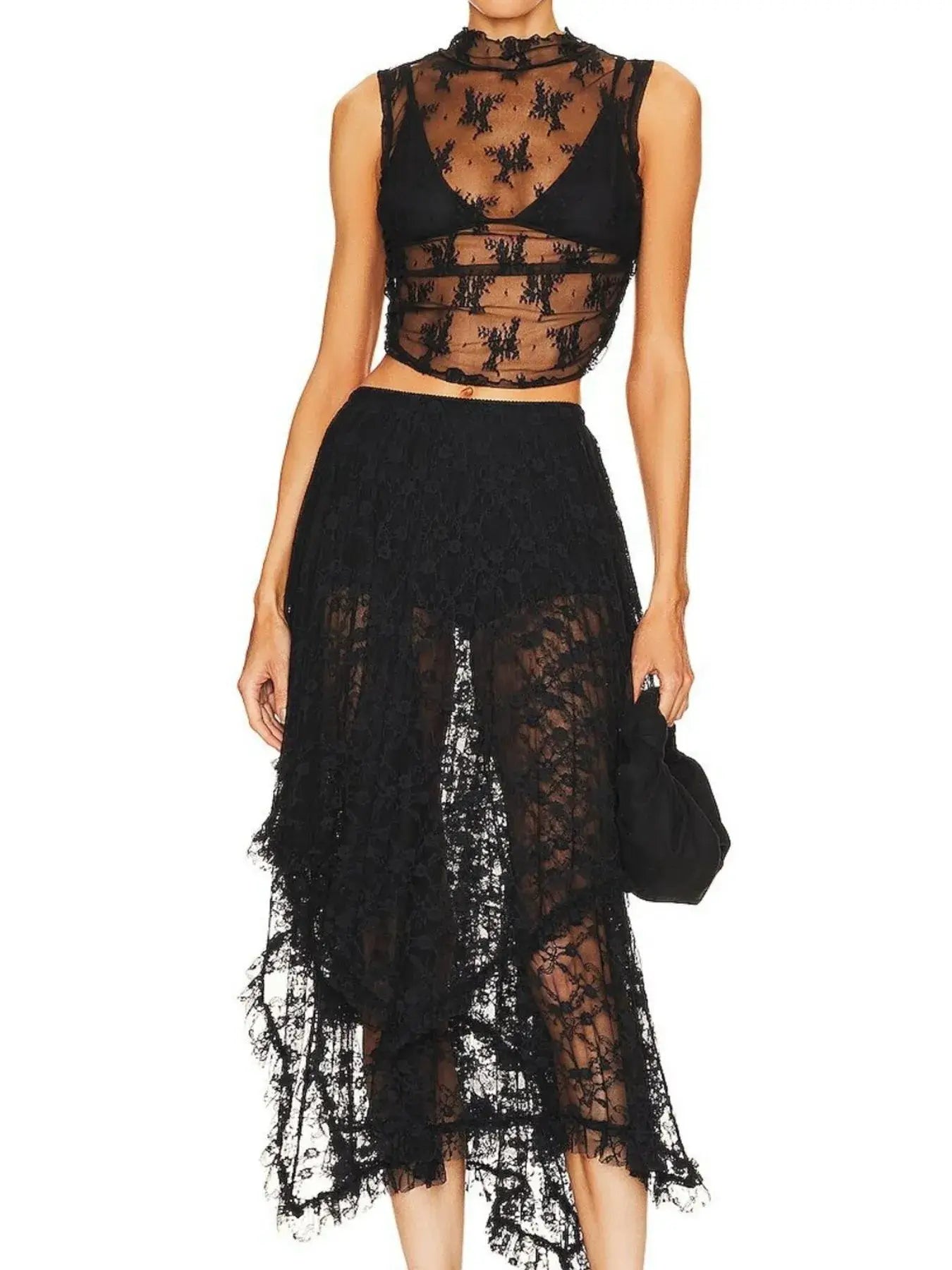 Elegant asymmetrical lace midi skirt with sheer details, worn with a matching lace crop top, creating a chic and modern silhouette.