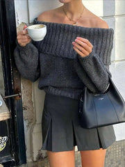 Woman wearing Off-Shoulder Ribbed Long Sleeve Sweater with coffee in hand, showcasing relaxed fit and style.