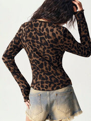 Back view of Leopard Print Button-Down Top with lace accents, paired with frayed denim shorts.