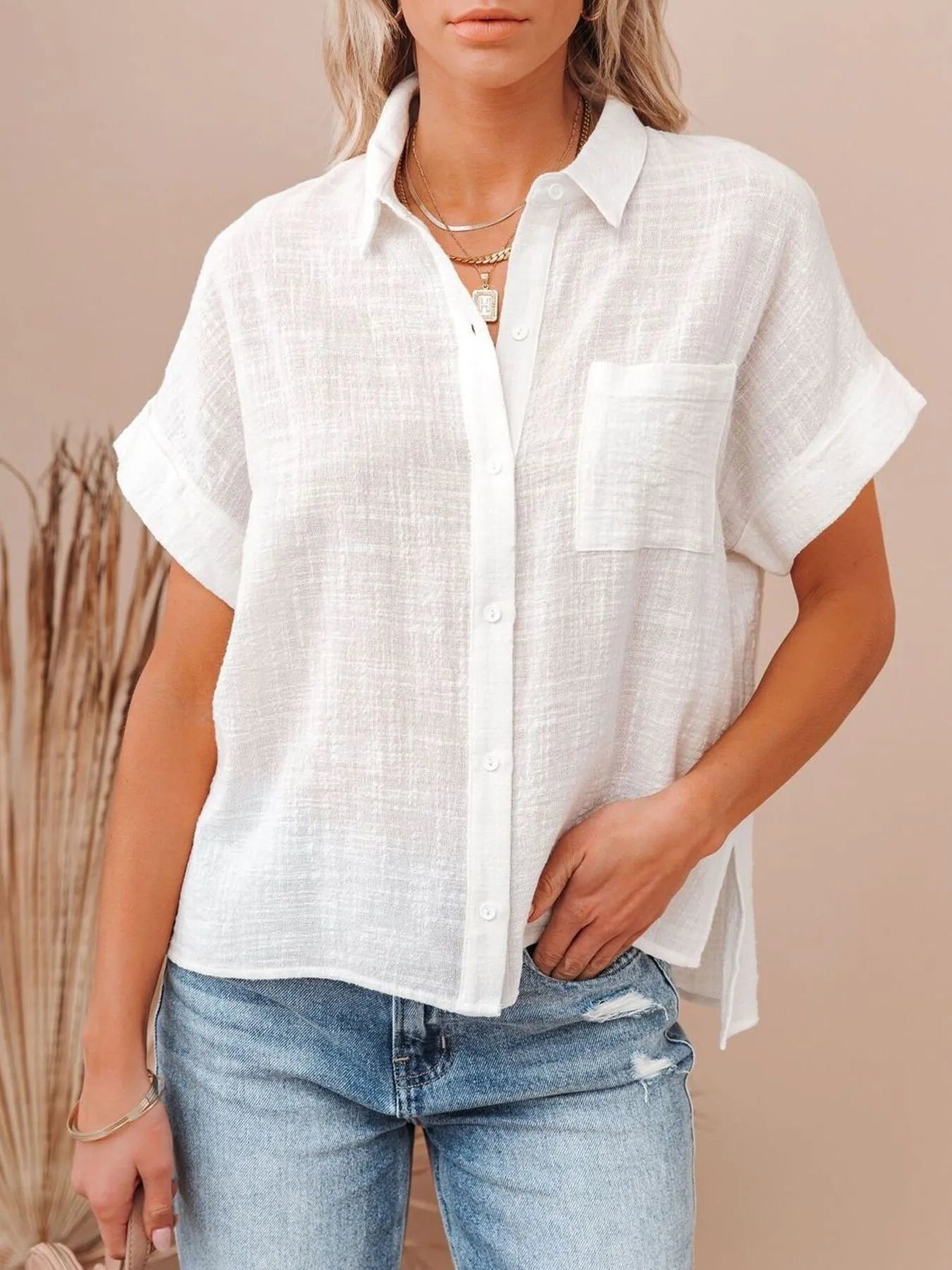 Cotton Button Up Short Sleeve Shirt worn by a woman, featuring a white fabric and a casual style.