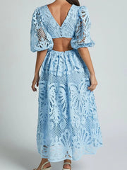 Woman wearing blue cutout back lace crochet V-neck dress, side view showcasing intricate detailing, perfect for elegant occasions.