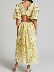 Elegant lace crochet V-neck dress with cutout back, showcasing intricate design, perfect for soirées and special occasions.