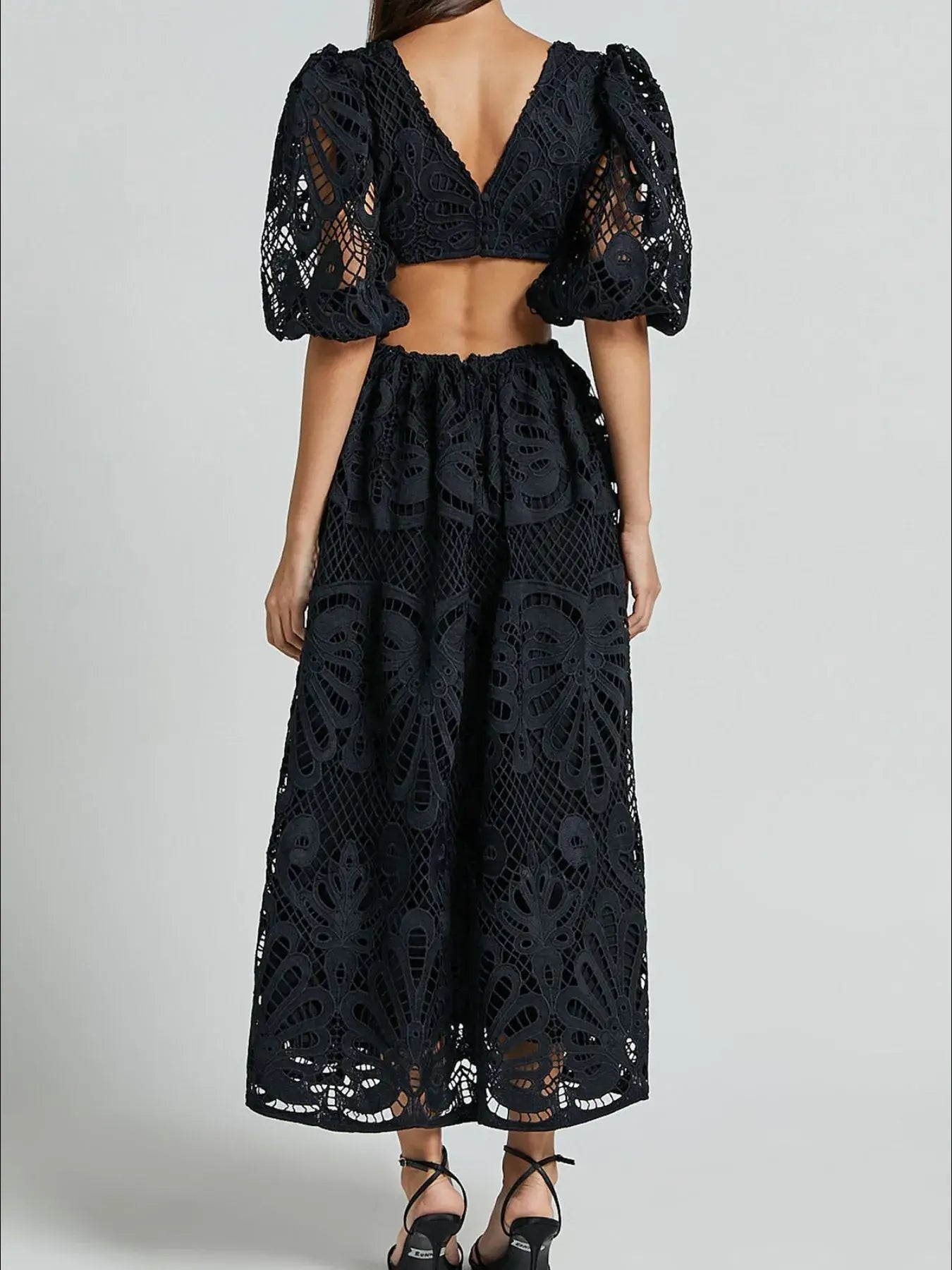 Elegant cutout back lace crochet dress with V-neckline, perfect for special occasions. Stylish and feminine evening wear.