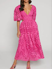 Elegant pink crochet lace dress with cutout back and V-neckline, perfect for evening events and special occasions.