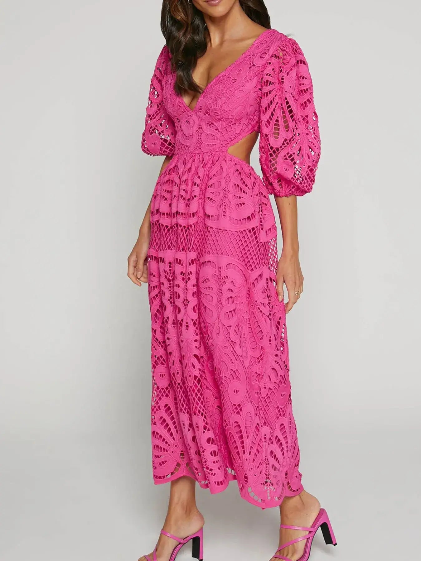 Elegant pink cutout back lace crochet V-neck dress with puff sleeves, ideal for sophisticated evening occasions.