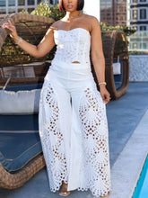 Cutout Tube Top and Wide Leg Pants Set featuring intricate lace design worn by a model outdoors by a pool.