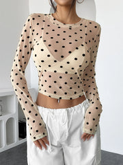 Polka Dot Mesh Long Sleeve Crop Top in black and white sheer fabric with polka dots, fitted silhouette, and chic design.
