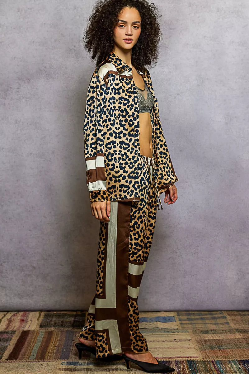 Woman wearing POL Leopard Printed Woven Wide Leg Drawstring Pants with matching top, showcasing stylish and bold leopard print outfit.