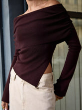 Ember Drape Top in dark burgundy with a diagonal off-shoulder neckline and angled hem, perfect for pairing with jeans or skirts.