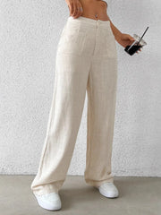 Fashionable Chic Wide-Leg Pants by GirlSavvi, cream pants with pockets, styled with white sneakers and a drink.