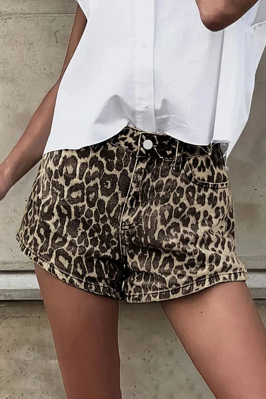 Model wearing leopard print shorts with pockets, paired with a white top. Casual, breathable cotton, perfect for summer styling.