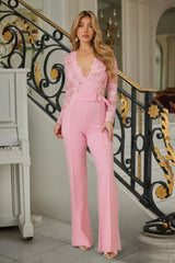Lace Crochet Long Sleeve Jumpsuit worn by a model, featuring a plunging V-neckline and elegant long sleeves.