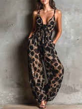Leopard Front Tie Detail Wide-Leg Jumpsuit worn by a model with pockets and a stylish design against a textured background.