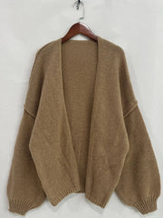 Oversized textured open front cardigan with dropped shoulders and voluminous sleeves, crafted from soft-touch polyester.