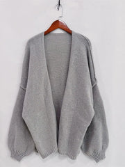 Open front dropped shoulder cardigan in gray, oversized with textured knit and voluminous sleeves, perfect for chic layering.