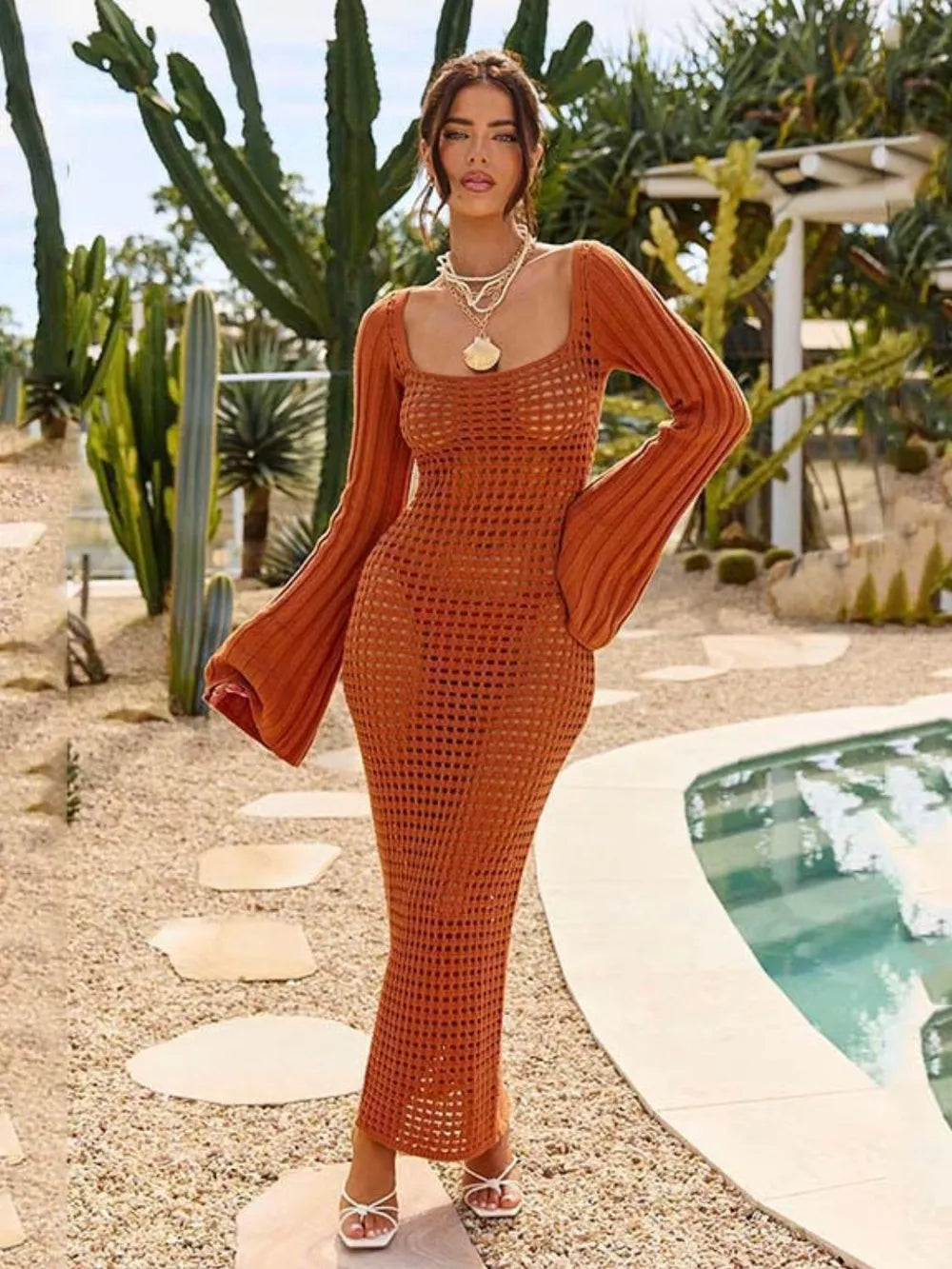 Openwork Square Neck Flare Sleeve Cover-Up Dress displayed outdoors, featuring sheer openwork design and flare sleeves.