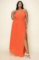 Chiffon Pleated Gold Trim Maxi Dress showcasing a vibrant orange color and elegant pleated design with a thigh-high slit.