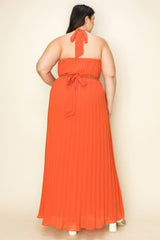 Back view of a woman wearing a Chiffon Pleated Gold Trim Maxi Dress in orange, showcasing its elegant pleated design.
