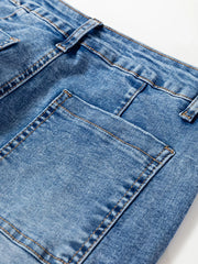 Close-up of seam detail loose fit cropped jeans with pocket, showcasing denim texture and stitching.