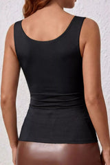 Back view of a model wearing a slim-fit black Summer Wide Strap Tank by GirlSavvi, showcasing its slightly stretchy fabric.