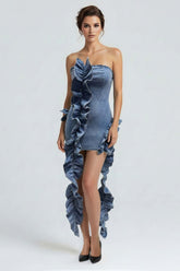 Model wearing a Wild Cascade Denim Sculpt Dress featuring ruffles and an extended train in structured denim.