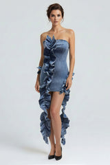 Model wearing a Wild Cascade Denim Sculpt Dress featuring ruffles and an extended train in structured denim.