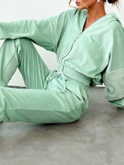 Sky blue zip up long sleeve top and pants set in plush velour fabric, featuring a drawstring waist and relaxed fit for cozy style.